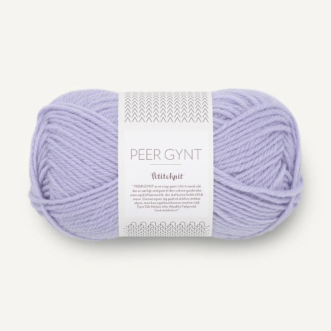 Perfectly Purple Ball of Sandnes Garn Peer Gynt yarn with a label on a white background