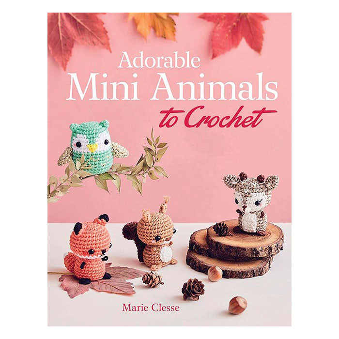 Book cover of 'Adorable Mini Animals to Crochet' with crochet animals on a pink background