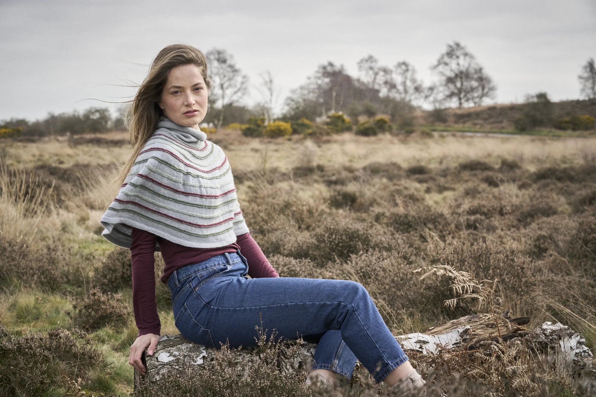 The Bramble & Fleece Sorrel Poncho showing the roll neck and textured stripes
