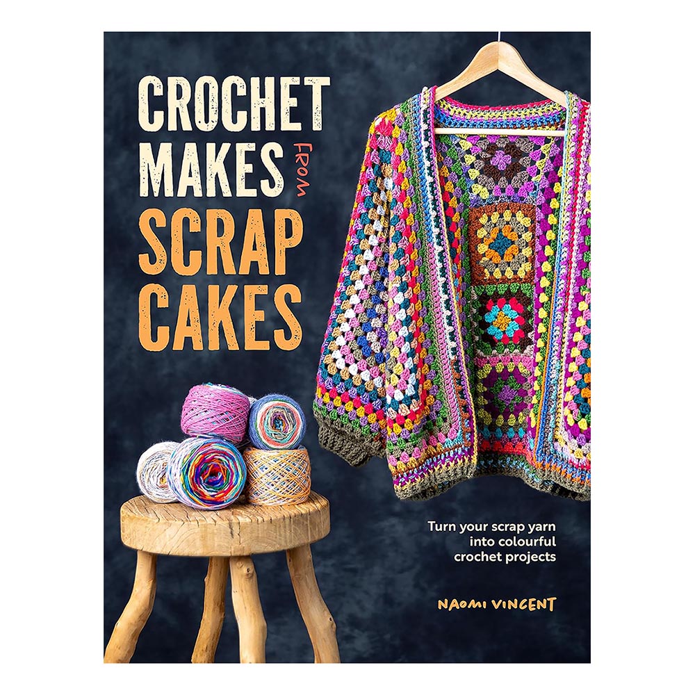 Book cover of 'Crochet Makes from Scrap Cakes' with a colorful crochet blanket and yarn on a wooden stool against a dark background.