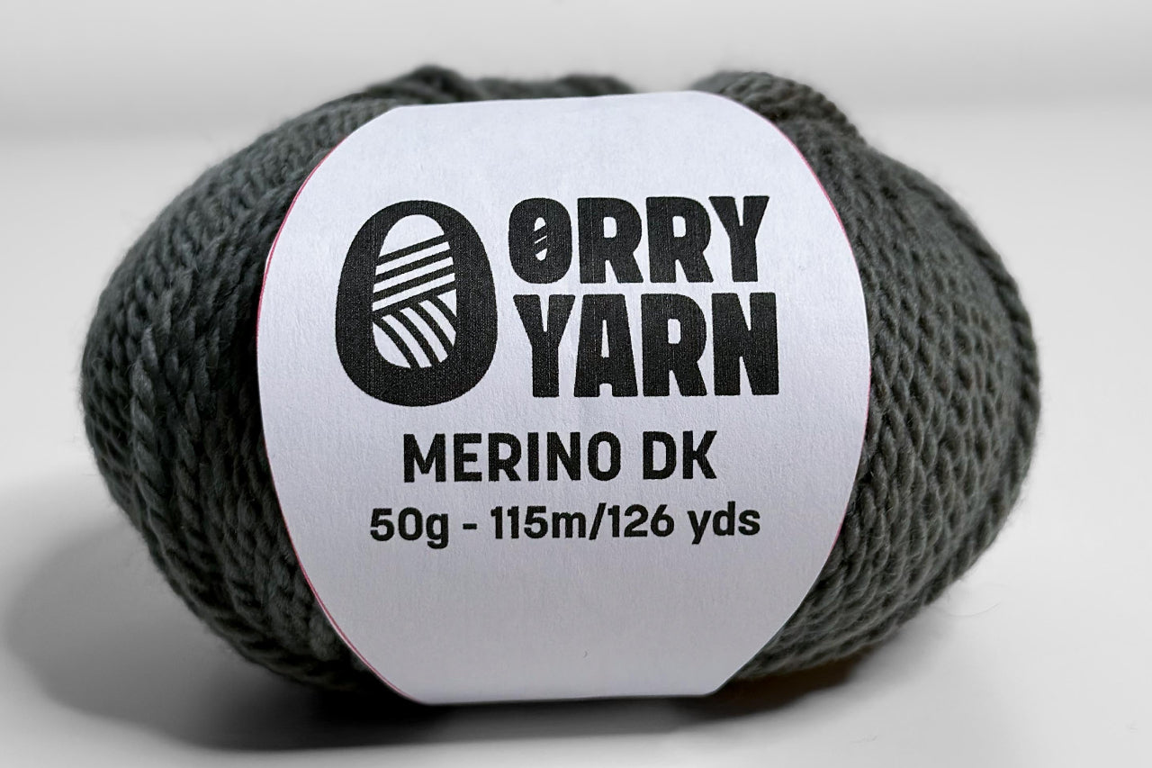 Ball of Orry Yarn green merino with ball band