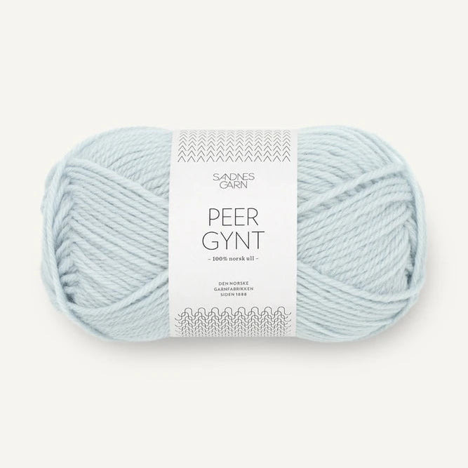 Light blue skein of Sandnes Garn Peer Gynt yarn Arctic Ice with a label on a white background