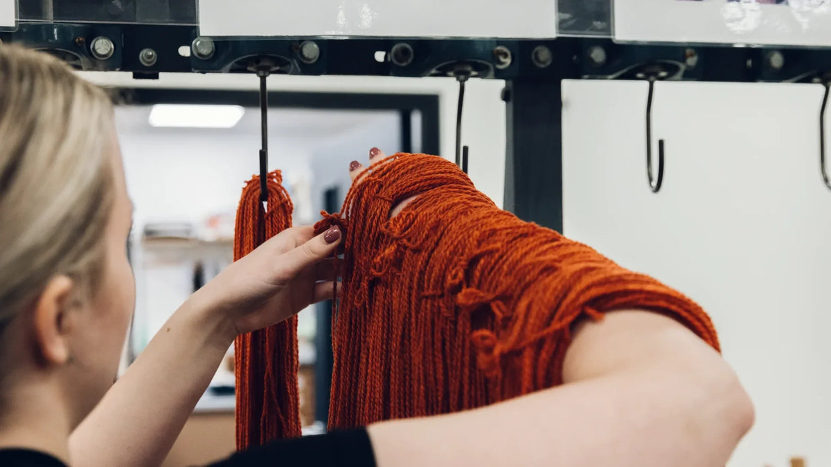 Skeins of Bramble & Fleece yarn hanging in the dye house at Laxtons in Yorkshire
