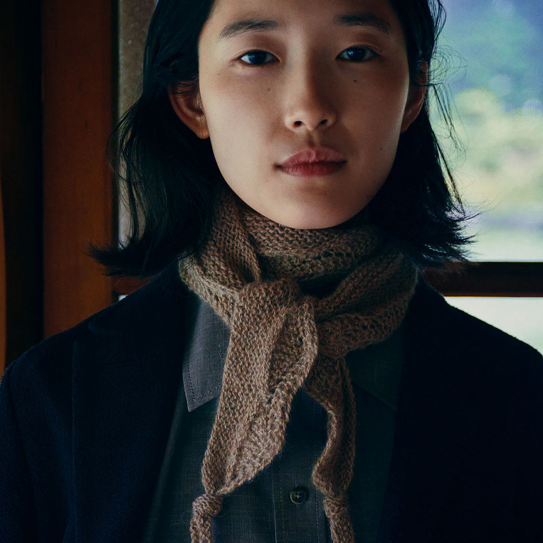 Isager lace Scarf on a dark haired model