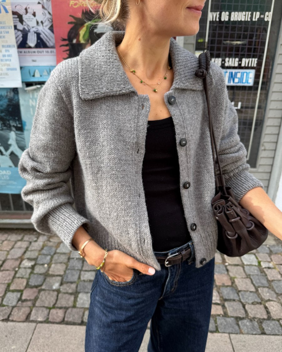 Woman wearing the light grey PetiteKnit Petra Jacket